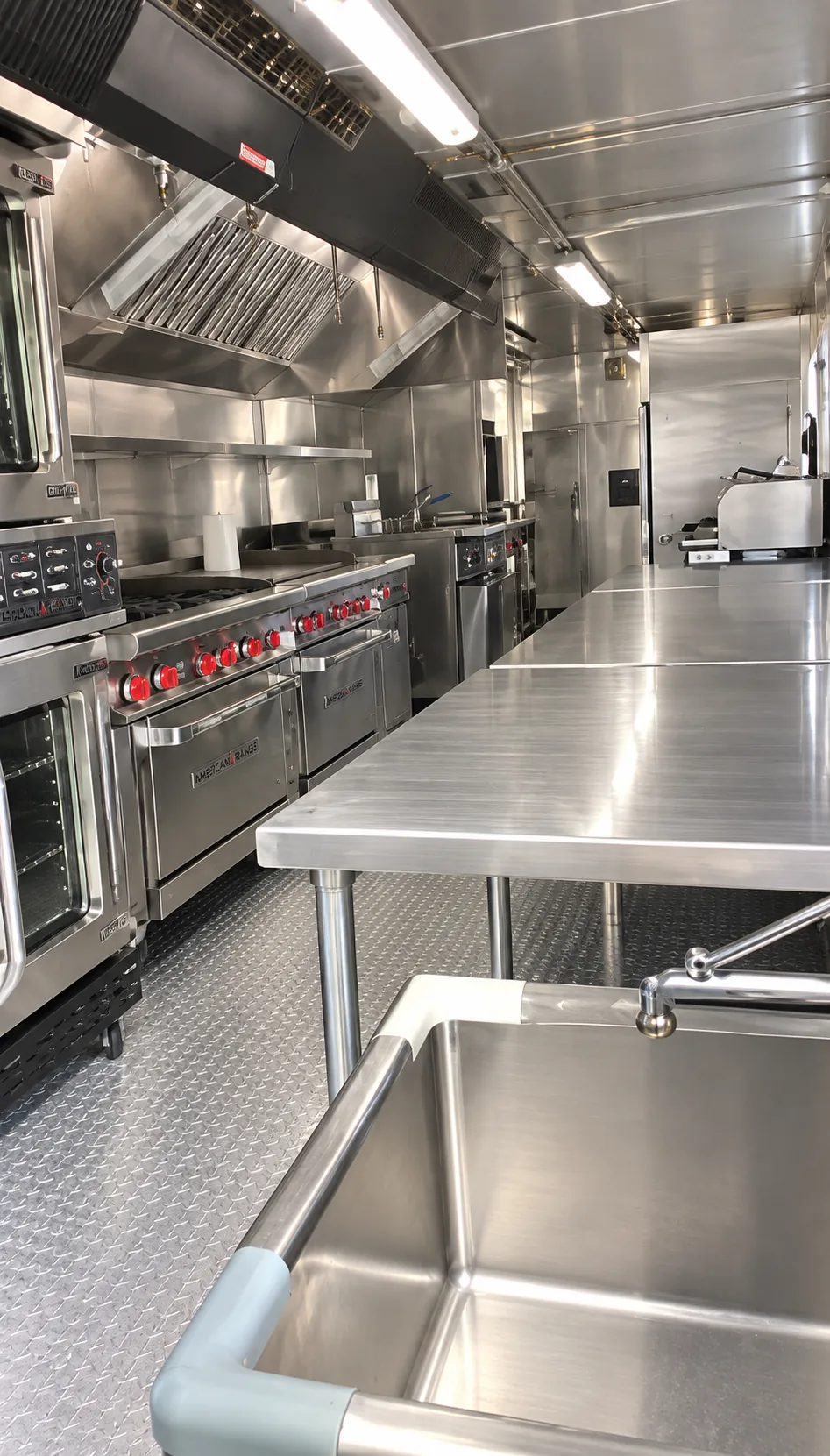 Commercial cooking line inside a 40 ft mobile kitchen rental